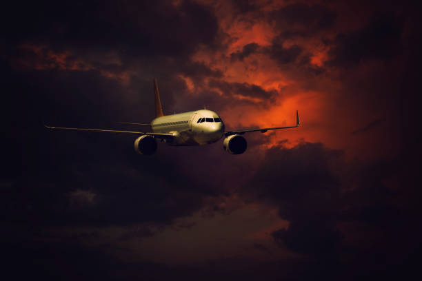 Passenger airplane flying at sunset