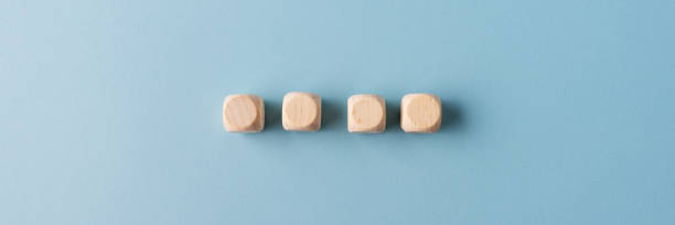 istock Four blank wooden dices placed in a row 1178603256