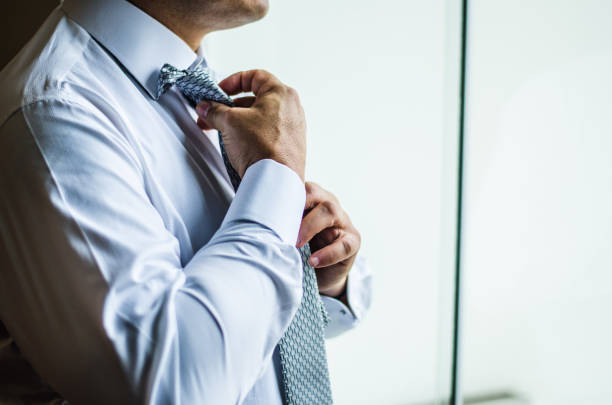 istock Businessman making a tie knot, formal suit. 1178603869