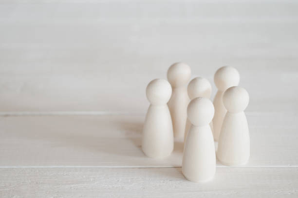 istock group of wooden dolls on the table 1178604536