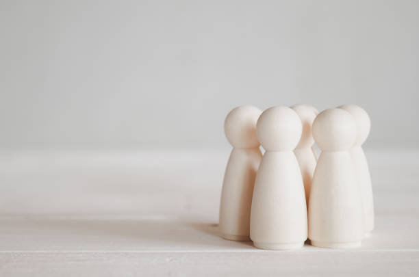 istock group of wooden dolls on the table 1178604736
