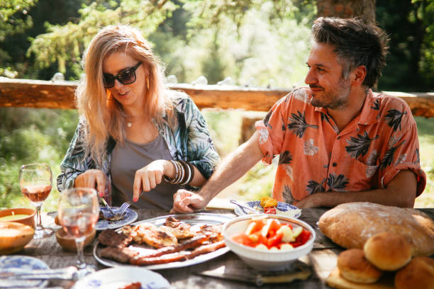 istock People having a picnic lunch in the nature 1178604889