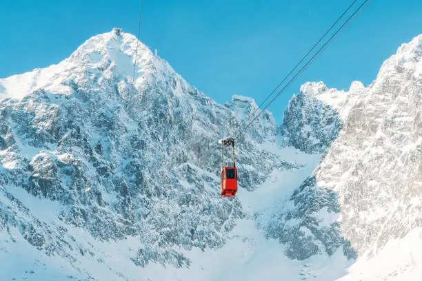 Photo of Tatra Mountains Ski Resort beautiful view on mountains peaks with red gondola
