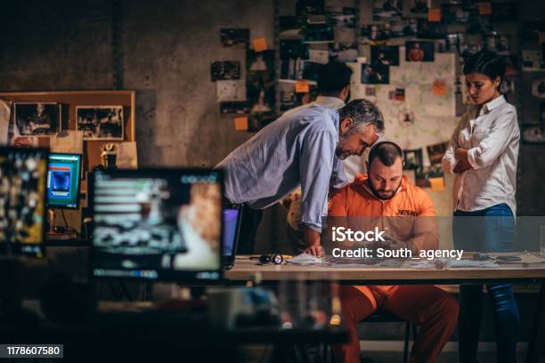 Detectives And Prisoner Stock Photo - Download Image Now - Prisoner, Interrogation, Computer Monitor