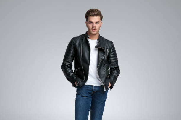 istock casual man standing with hands in pockets and looking ahead 1178609686