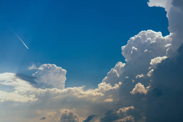 Cumulonimbus storm clouds in the blue sky stock photo
