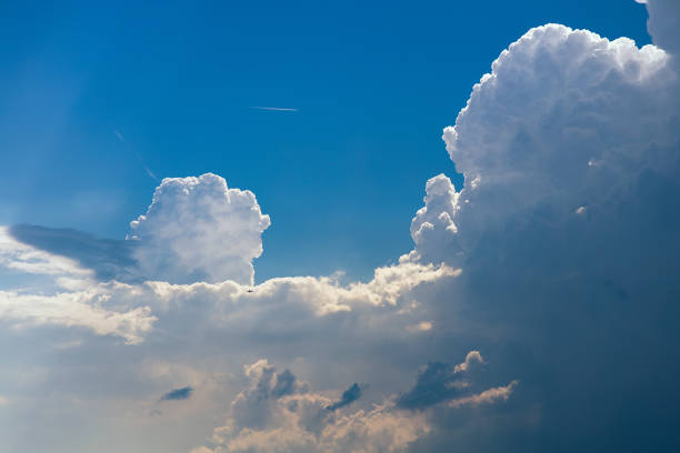 Cumulonimbus storm clouds in the blue sky stock photo
