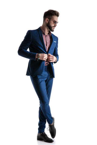 istock formal businessman fixing jacket and looking down pensive 1178610556