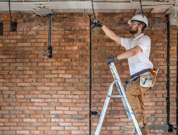 istock Electrician with tools, working on a construction site. Repair and handyman concept. 1178616504