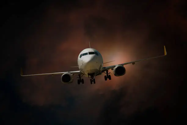 Photo of Airplane landing at dusk