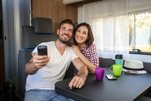 Couple watching a movie in a RV
