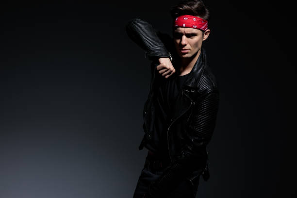 istock arrogant cool biker wearing leather jacket and red bandana 1178620152