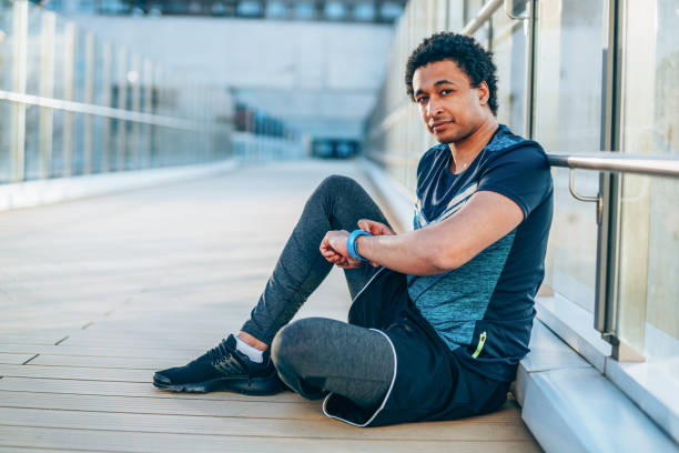 istock Sportsman checking his smart watch 1178621338