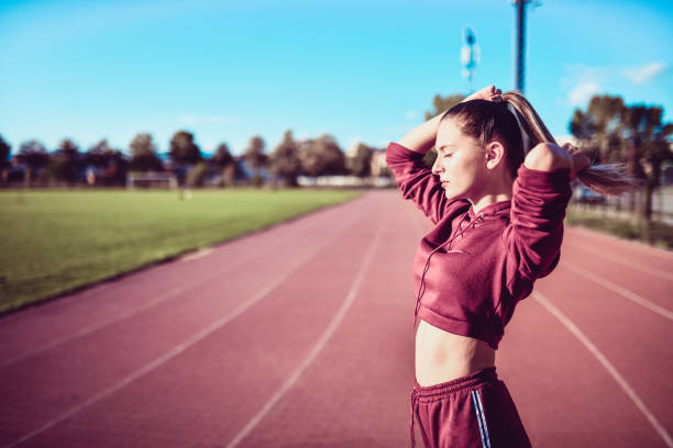 istock Female Tying Hair Before Running 1178621348