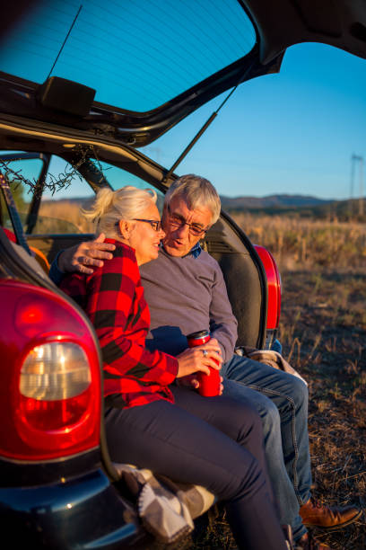 istock Senior couple outdoors with car 1178621649