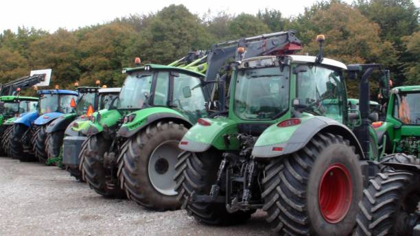 istock Tractor Agricultural Machinery Plus Tree View 1178622447