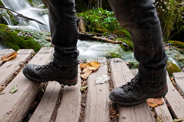 istock Man walking on a wooden bridge, 1178622489