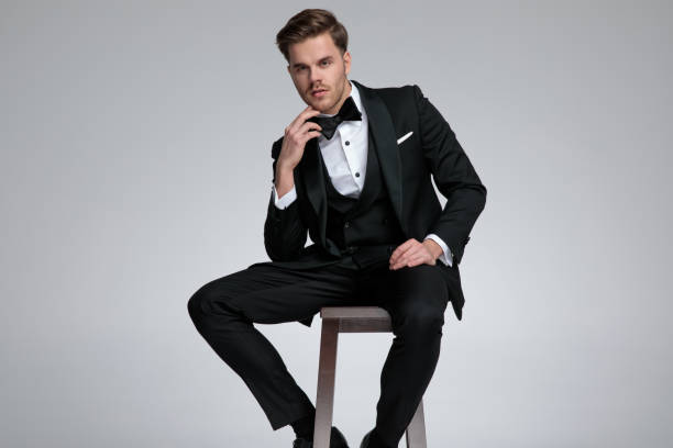istock elegant modern groom wearing suit and bowtie 1178625044