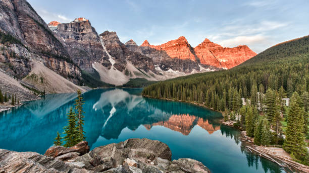 Moraine Lake in Banff National Park in Alberta Canada taken at the peak color of sunrise Moraine Lake in Banff National Park in Alberta Canada taken at the peak color of sunrise moraine lake stock pictures, royalty-free photos & images