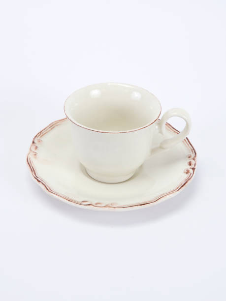 istock Empty white ceramic coffee or tea cup and saucer isolated on white background 1178642023