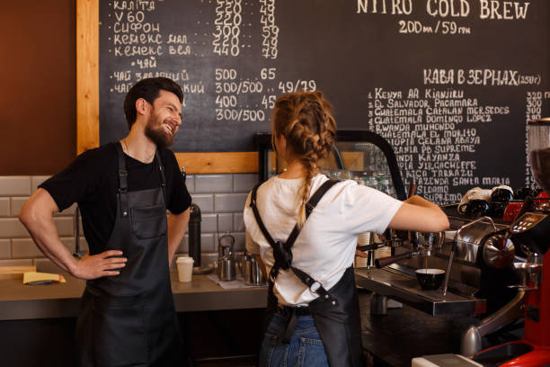 istock Professional barista team brewing coffee using coffee machine in coffee shop. 1178643893