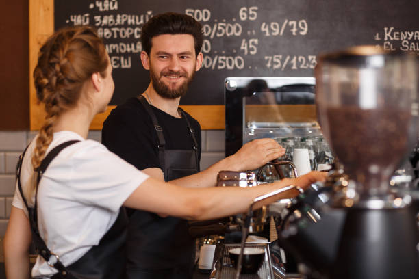 istock Professional barista team brewing coffee using coffee machine in coffee shop. 1178643961