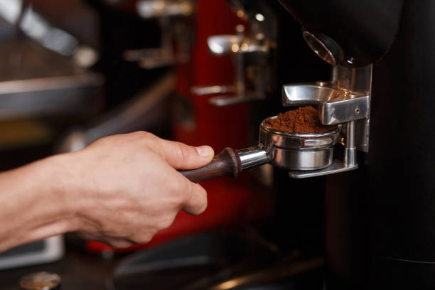 istock Professional coffee grinder grinding fresh roasted coffee beans. 1178644250