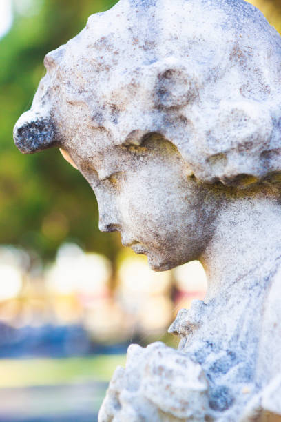 istock Angel, old statue of angle in cemetery, background with copy space 1178645921