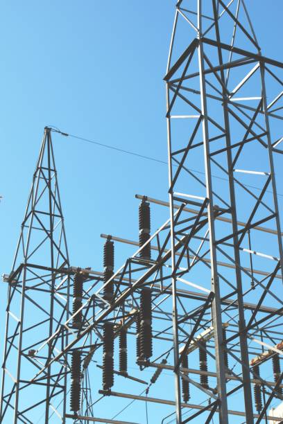 istock High voltage electrical insulators at a power station. Low angle shot against a blue sky. 1178646788