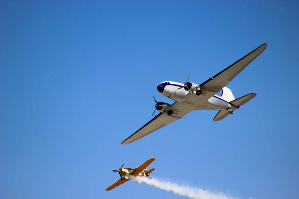 istock airplane with propeller flying in blue sky 1178647310