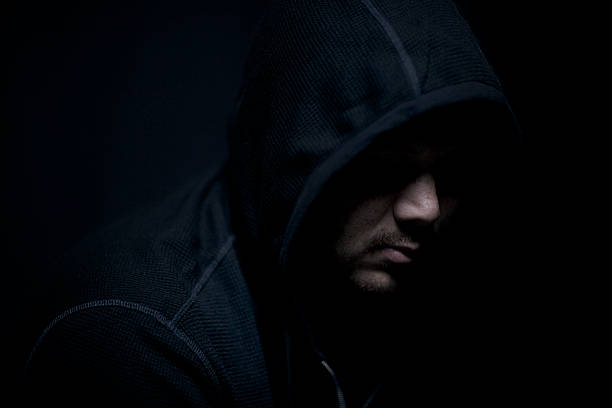 istock Man Wearing Hoodie Looking Down 117866544