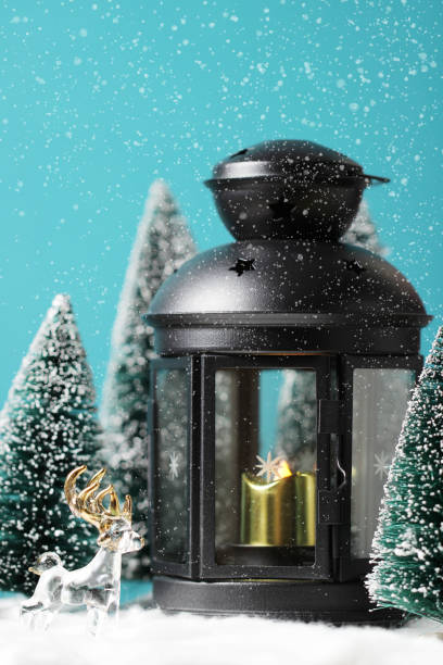 istock Christmas background with deers, Lantern and christmas trees on table. 1178666114