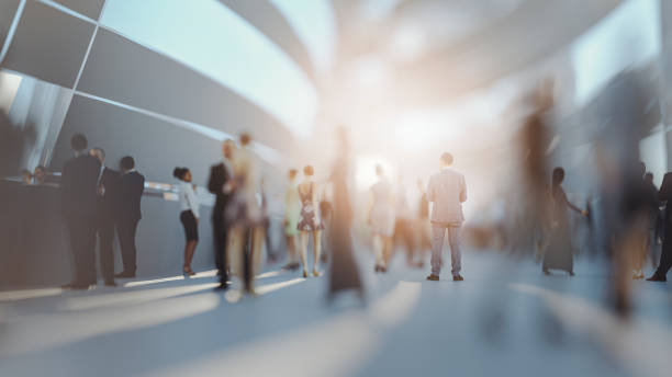 Crowds of people walking on futuristic street Crowds of people walking on futuristic street. This is entirely 3D generated image. defocused office business motion stock pictures, royalty-free photos & images
