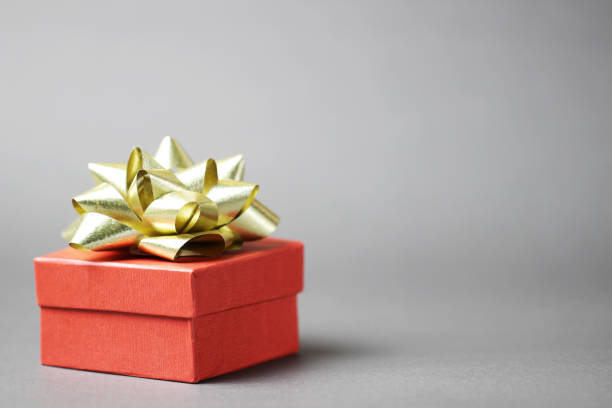 istock Christmas red gift box on grey background. 1178670031
