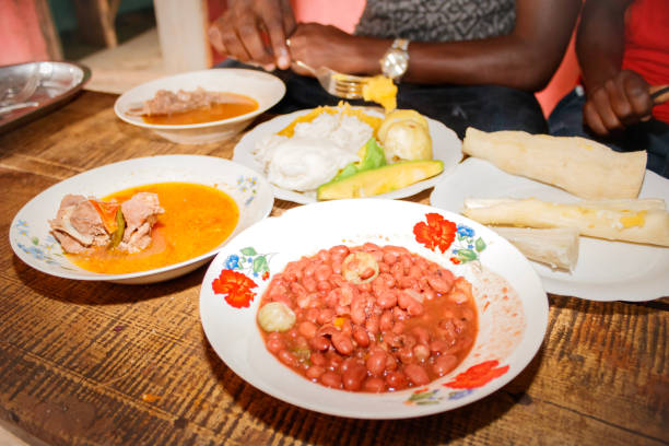 Traditional Ugandan food consisting of goat meat, cassava, potato, beans, maize meal, sweet potato, Uganda, Africa stock photo