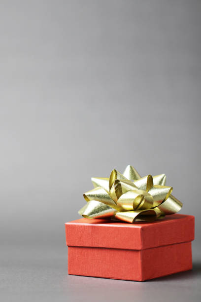 istock Christmas red gift box on grey background. 1178672412