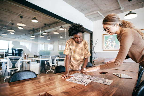 istock Two business woman working together over one interesting project 1178673064