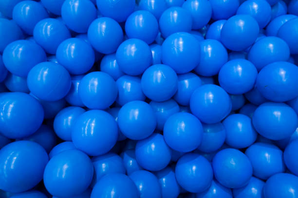 group of blue plastic balls indoor playground - blue ball imagens e fotografias de stock