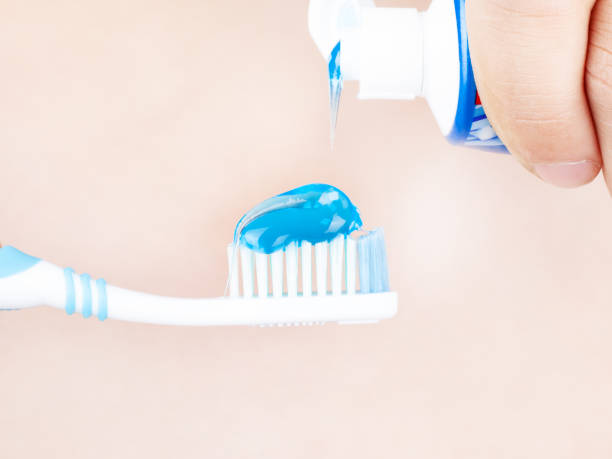 istock toothpaste is applied to the toothbrush,tooth brushing  close up 1178677595