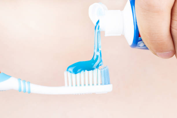 istock toothpaste is applied to the toothbrush,tooth brushing  in hand 1178677625
