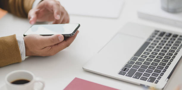 istock Businessman looking at information in blank screen smartphone while working on his project 1178680245