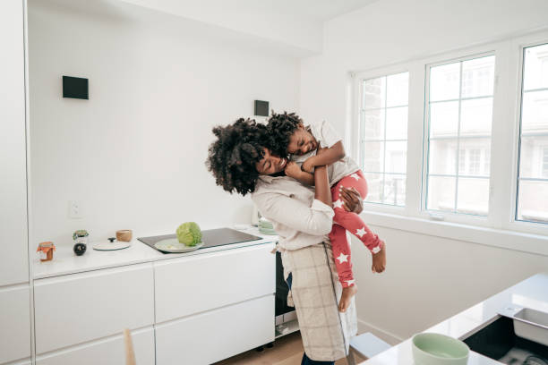 istock Mom hugging daughter 1178684357