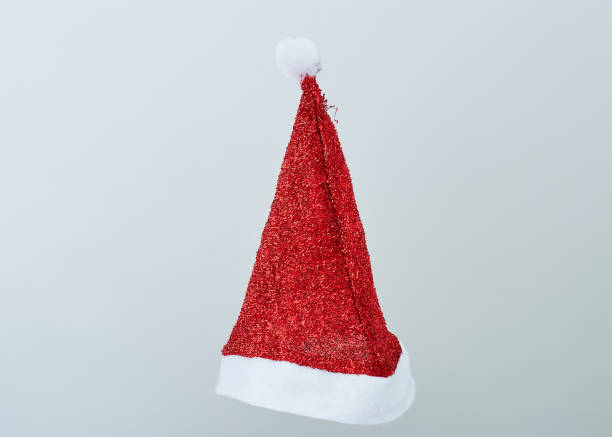 istock Santa red hat isolated in gray background 1178685033