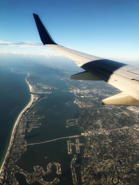 istock View of Belleaire Beach from airplane window with wing 1178687037
