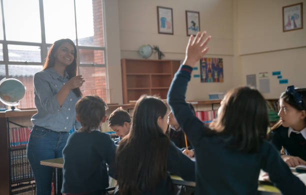 istock Girl at the school asking a question in class 1178693863