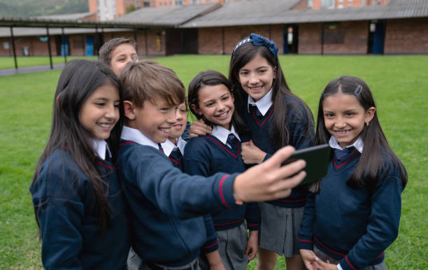 istock Happy group of students taking a selfie at school 1178693898