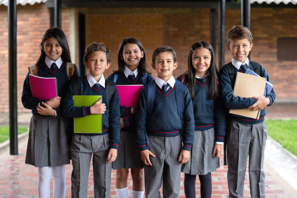 istock Happy group of students in their uniforms at the school 1178693946