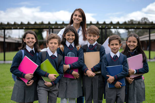 istock Happy group of middle school students with their teacher 1178694011
