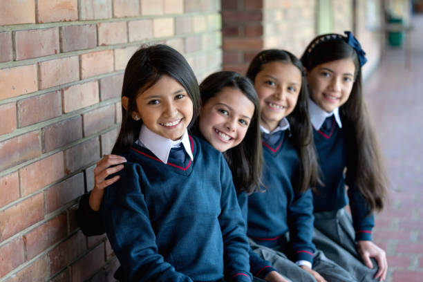 istock Happy group female students at school 1178694028