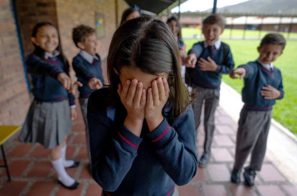 istock Girl crying while being bullied at the school 1178694075